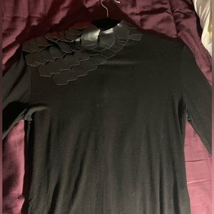 Black tee with black hexagons on left shoulder